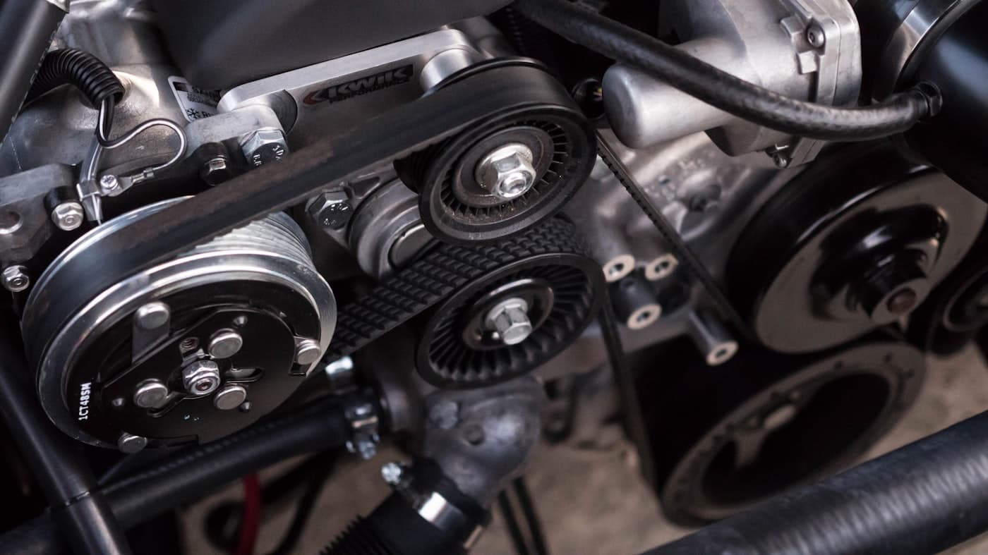 Close-up of belts and pulleys on an engine